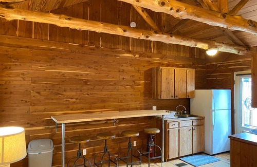 Prairie Lea House | Son's Blue River Camp LogCabin3 - Romantic Log Cabin on the River with view!