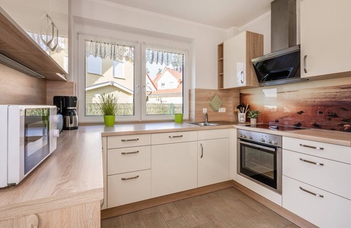 Korswandt Apartment | Sonnenpark 02 - Fireplace and sunny terrace in a quiet location