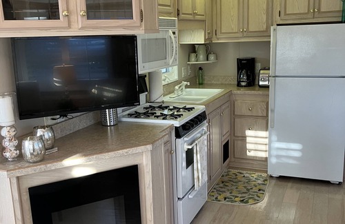 Sandbridge Cottage | Sophisticated waterfront Sandbridge cottage on Back Bay, minutes to the ocean.