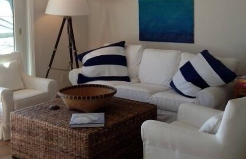 Lake Township Cottage | Sought-After West-End, Designer Cottage Right on Water