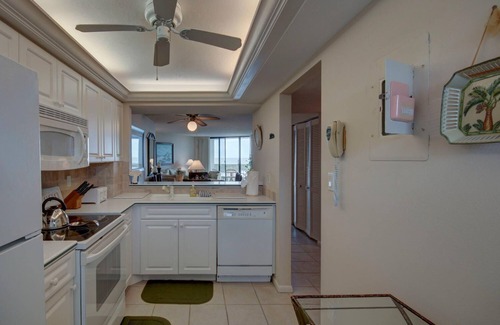 Marco Island Condo | South Seas Tower 4 #701 Looking at Sunset. Decorated with light pastel décor.