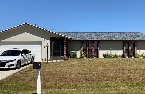 Interchange Square House | Space Coast 4 Bedroom Hot Tub and Pool Getaway - 10 min to beach!