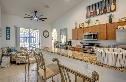Pelican Villa | Spacious 4 BR/3 bath waterfront Villa with heated pool, spa, kayaks and bikes