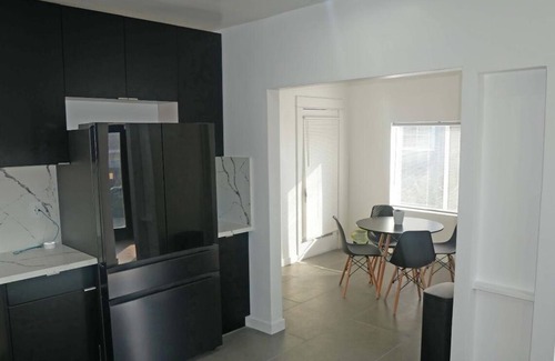 Mid City House | Spacious 4BR Home w/Gym, Fireplace & Prime LA Location. Near USC & Crypto Arena