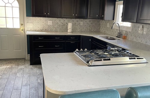 Brighton House | Spacious 4BR Lakefront Home with dock, deck, wifi, AC, & large yard in Brighton