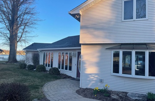 Brighton House | Spacious 4BR Lakefront Home with dock, deck, wifi, AC, & large yard in Brighton