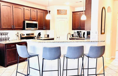Ennis House | Spacious 5 Bedroom Home, Huge Swim Spa & Private Theater with Popcorn Machine!