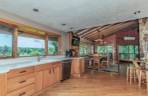 Painesville Cabin | Spacious 5-bedroom lodge on 35 acres with pool house, pool, 2 ponds, waterfall!