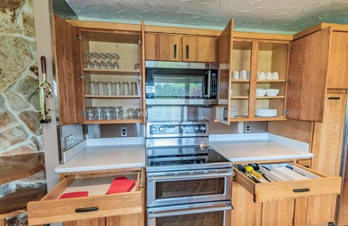 Painesville Cabin | Spacious 5-bedroom lodge on 35 acres with pool house, pool, 2 ponds, waterfall!