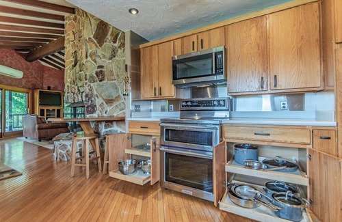 Painesville Cabin | Spacious 5-bedroom lodge on 35 acres with pool house, pool, 2 ponds, waterfall!