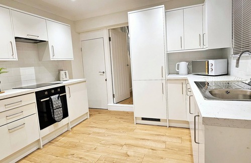 Bedford House | Spacious 5BR House Near Town | Kitchen, Dining & Lounge