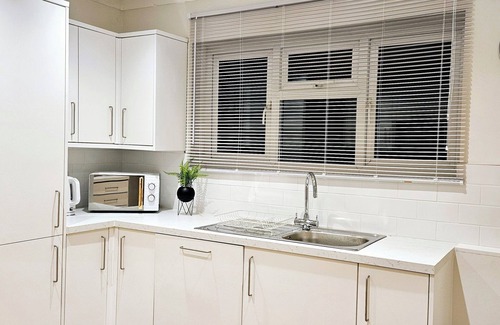 Bedford House | Spacious 5BR House Near Town | Kitchen, Dining & Lounge