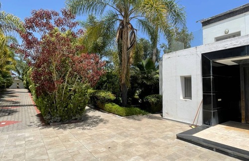 Oulad Slama Villa | Spacious 6-bedroom villa in delightful Kenitra with AC, fitness room, WiFi