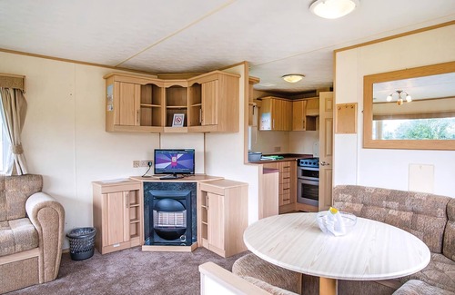 Llanllwchaiarn House | Spacious and comfortable 12ft-wide caravan with one double and two twin.
