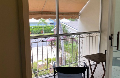 Indian River Shores Condo | Spacious condo with views of oak canopy, gardens & pool. 5-minute walk to beach.