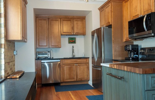 Edgerton Condo | Spacious Condo: Historic Boutique Rental in Downtown Edgerton