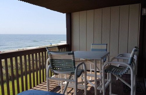 Wilmington Beach Condo | Spacious condo with large deck to view the beautiful ocean just a few feet away.