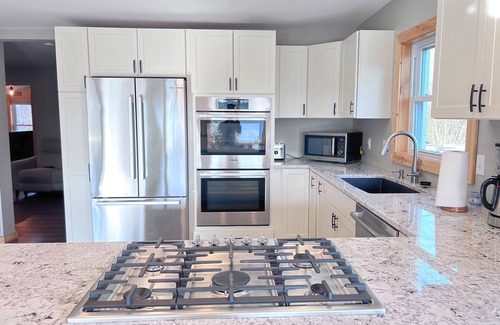 Alanson Cabin | Spacious Downtown Alanson Riverfront Cabin with Amenities- 10-12 guests