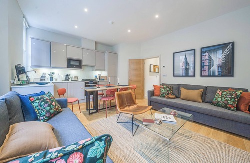 Shoreditch Apartment | Spacious first-floor apartment with lift access on Great Titchfield Street. Sleeps 18 with 3 bedrooms, 3 living rooms, 3 kitchens, and 3 bathrooms. Steps from Oxford Street and Soho.