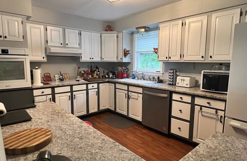 Pittsburg House | Spacious five-bedroom home off Back Lake with direct trail access on Spooner Rd