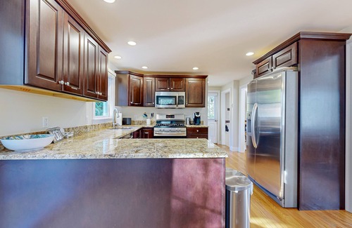 Mashpee House | Spacious home close to Peters Pond Beach with porch, AC, W/D, & water view