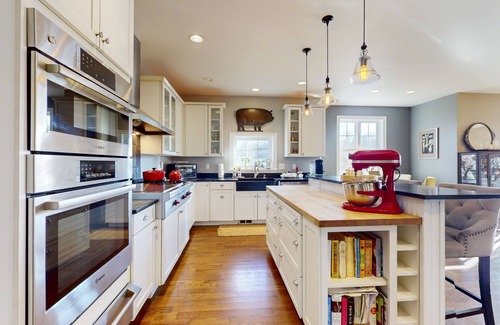 South Burlington House | Spacious home near skiing with game room, pizza oven, alfresco dining, & firepit