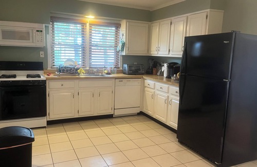Belmar House | Spacious home with a view of the Shark River and a game room.