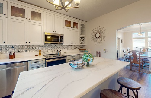 Gardiner House | Spacious home with river views, hot tub, covered porch, deck, grill, & W/D