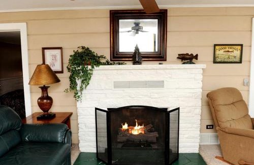 West Branch House | Spacious Lake Cabin Rental with a Private Hot Tub in Ogemaw County, Michigan