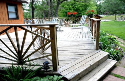 West Branch House | Spacious Lake Cabin Rental with a Private Hot Tub in Ogemaw County, Michigan