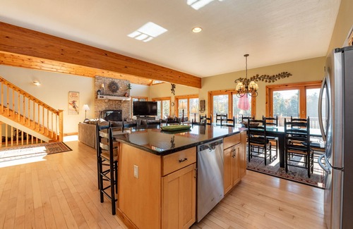 Waterfront Greens House | Spacious Lake Escape w/Hot Tub, Dock & Fireplace