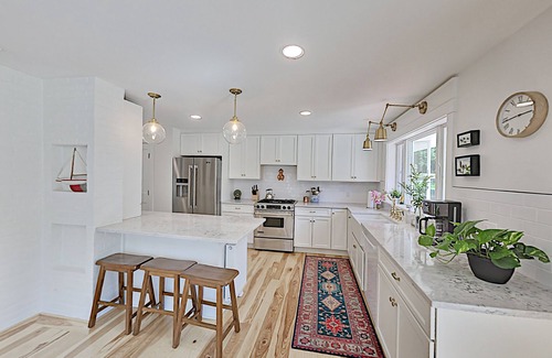 Newcastle House | Spacious lakefront home on lush 5-acre lot with sunny deck & private dock