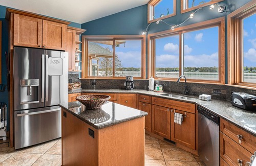 Paw Paw Lake House | Spacious lakefront home with a hot tub, private beach, washer/dryer, & AC