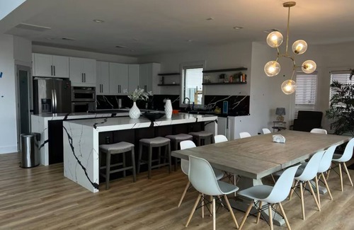 April Sound House | Spacious Luxury Lakefront Home with Pool and Jacuzzi, Firepit, and Game Room!