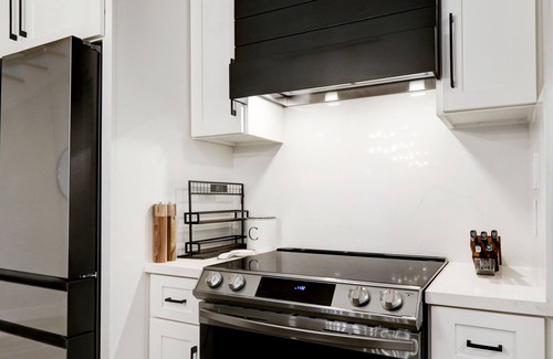 Memorial Parkway House | Spacious Luxury Modern Farmhouse Gameroom + Chef’s Kitchen + EV Charger