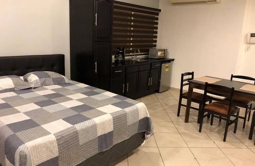 San Pedro Sula Apartment | Spacious Studio Apartment . Secured and quiet building with garage on premises