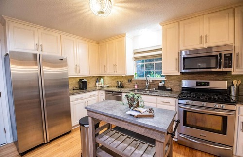Reservoir House | Spacious, stylish home with fenced yard!