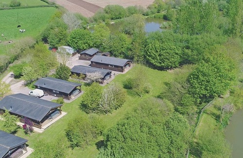 Cullompton Ski Chalet | Spacious timber lodge with one double and one single in one room.