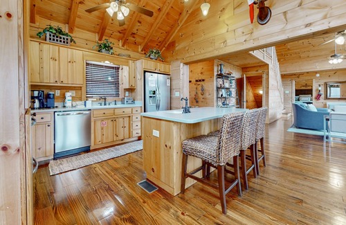 Big Creek Cabin | Spacious waterfront property with deck, hot tub, fireplace, & central AC