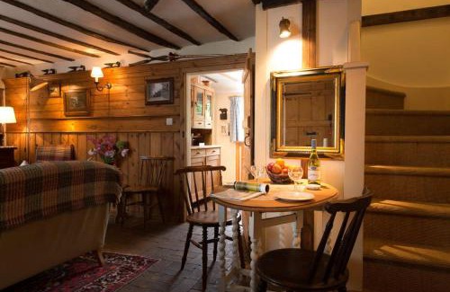 Long Melford House | Spadgers, a flax workers cottage next to fields in a Medieval Village