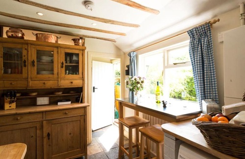 Long Melford House | Spadgers, a flax workers cottage next to fields in a Medieval Village