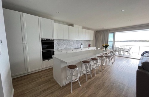 Bonnells Bay House | Sparkle by the Lake at this peaceful direct waterfront luxury homenSleeps 10