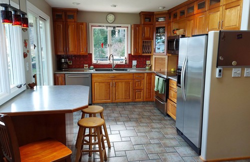 Heriot Bay House | Spectacular beach front property with stunning view of coastal mountains. n