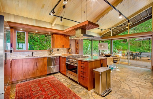 Innis Arden House | Spectacular mid-century home with two-story fireplace, huge deck, & water views