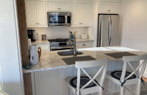 Mashpee Condo | Spectacular Ocean View Maushop Village home Steps to Private Beach