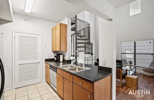 West Campus Apartment | Spiral Stairs to Loft Bedroom Balcony with Shade
