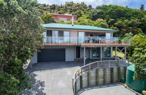 Mangawhai Heads House | Spits End - Large, modern holiday home with stunning views a short walk to estuary surf beach
