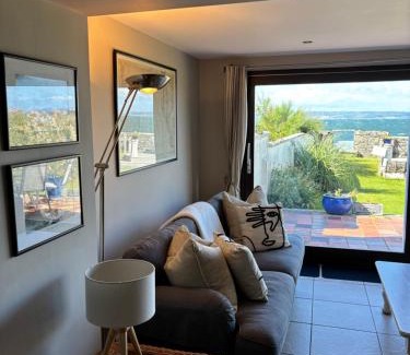 Bangor House | Splash Cottage beach house with Sea lapping Garden