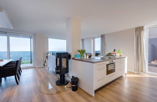 Kappeln Apartment | StarBoard: Baltic Sea vacation apartment with Baltic Sea view, two terraces, sauna & fireplace.