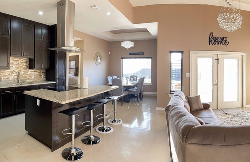 Brownsville House | Stately retreat with backyard oasis - pool, inviting patio - plus modern kitchen